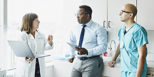 image of physician, nurse and business person