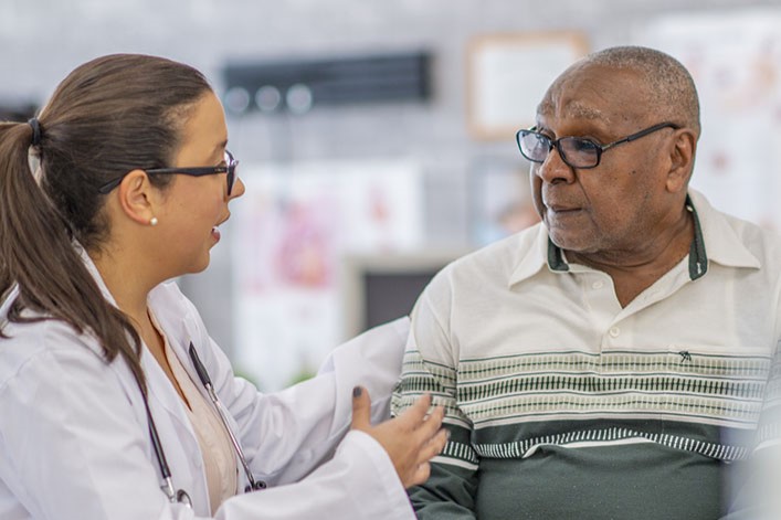 physician helping a patient