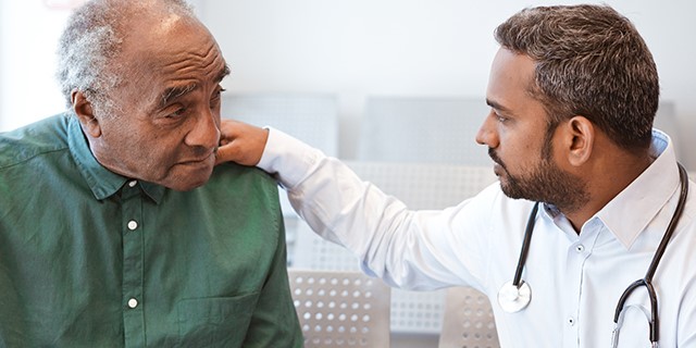 physician and elderly man